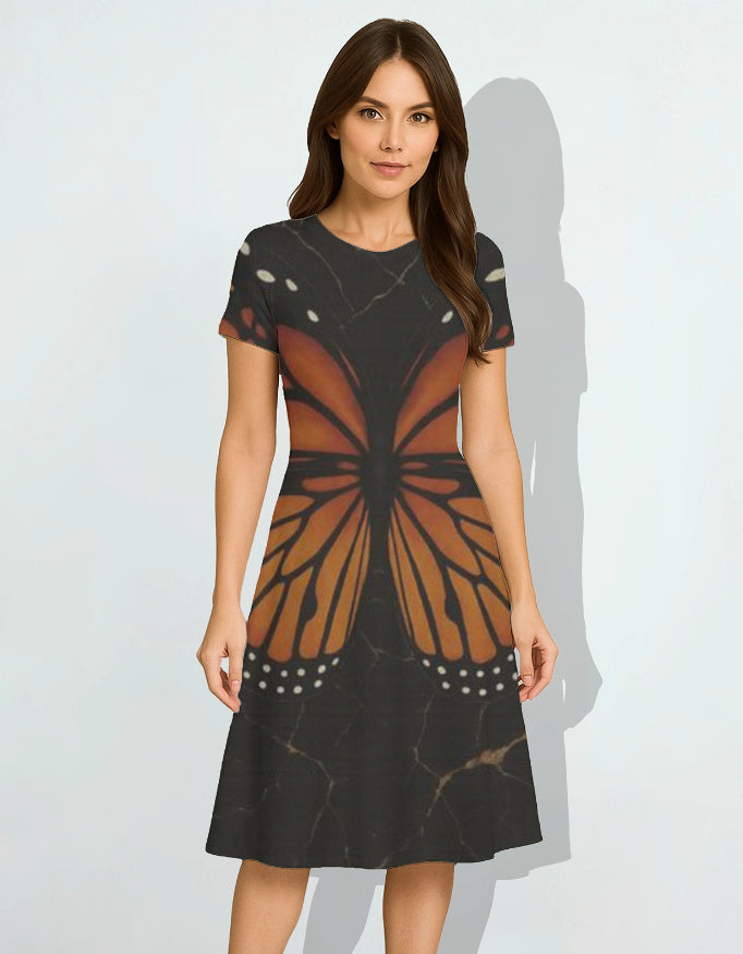 Woman wearing a black dress with butterfly design on a white background