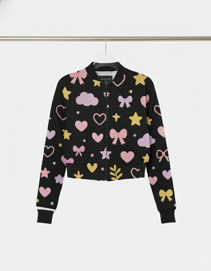 Black bomber jacket with colorful heart, bow, and cloud patterns on a white background